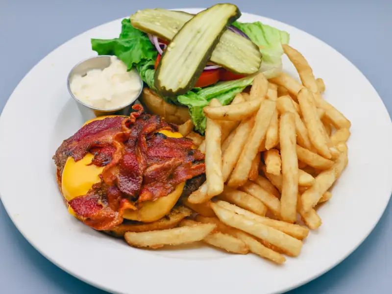 Topped with bacon, lettuce, tomato & American cheese on a toasted brioche bun.