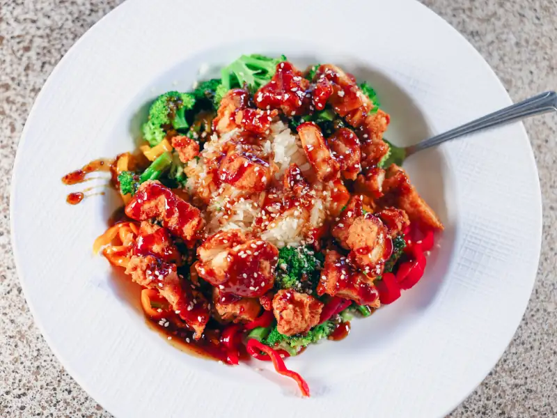 Rice topped with broccoli, peppers, chicken and drizzled with teriyaki sauce.