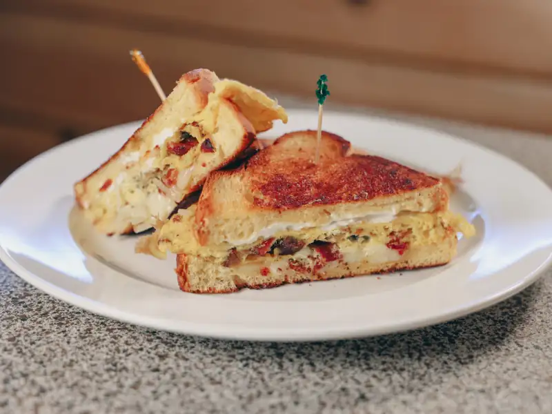 Brioche Texas toast, Monterey jack cheese, sour cream, bacon, sausage & scrambled eggs.