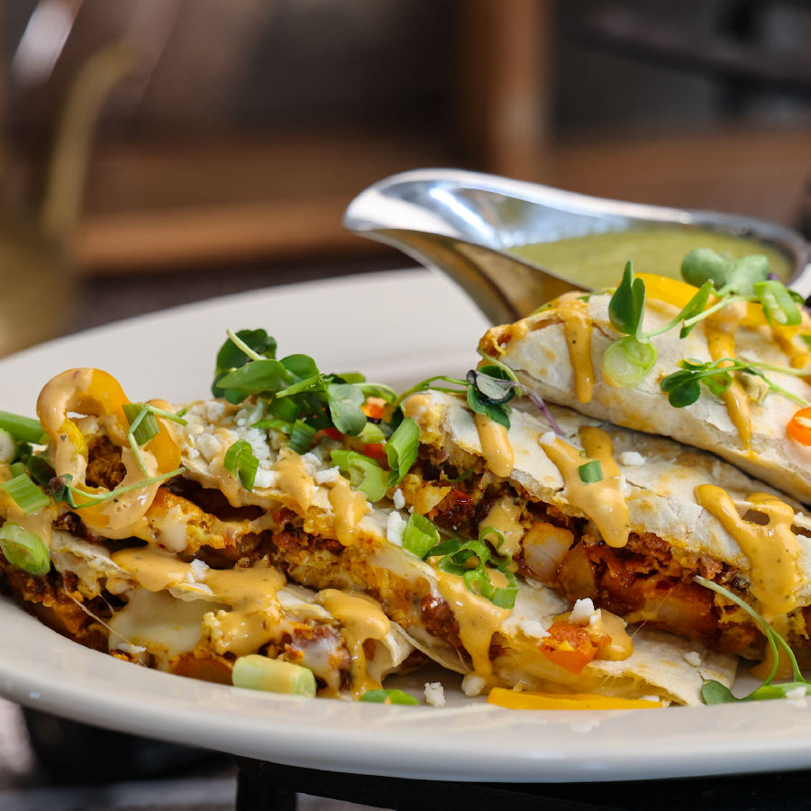 Chorizo quesadilla drizzled with melted cheese.